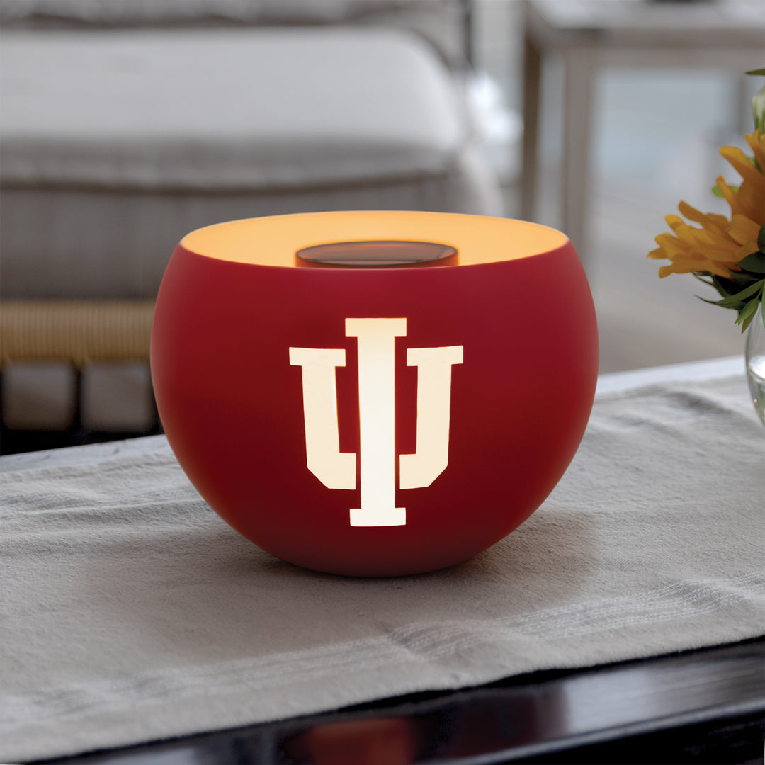 Red spherical light with a logo on a table